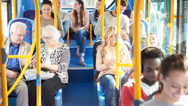People riding a bus