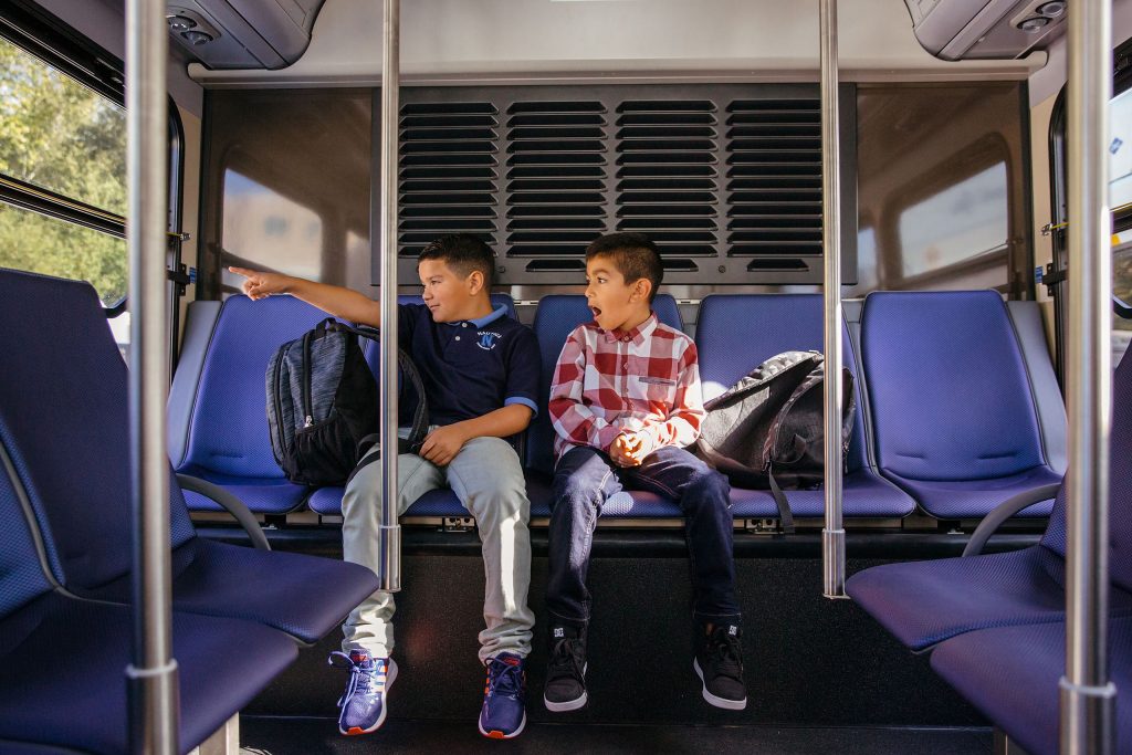 Boys on bus looking out the window