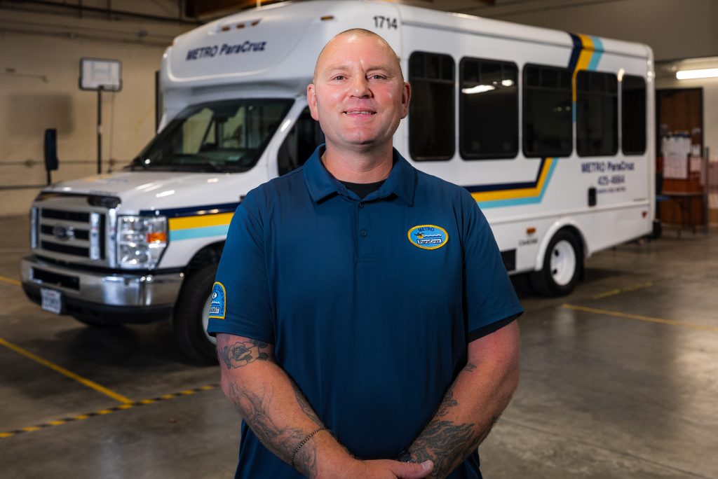 Steve standing in front of a SC Metro van