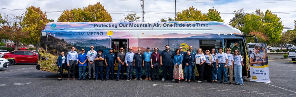 People standing in front of a bus